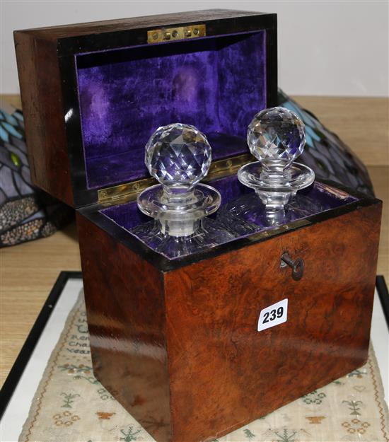 A Victorian burr wood decanter box enclosing a pair of cut glass decanters, height 27cm